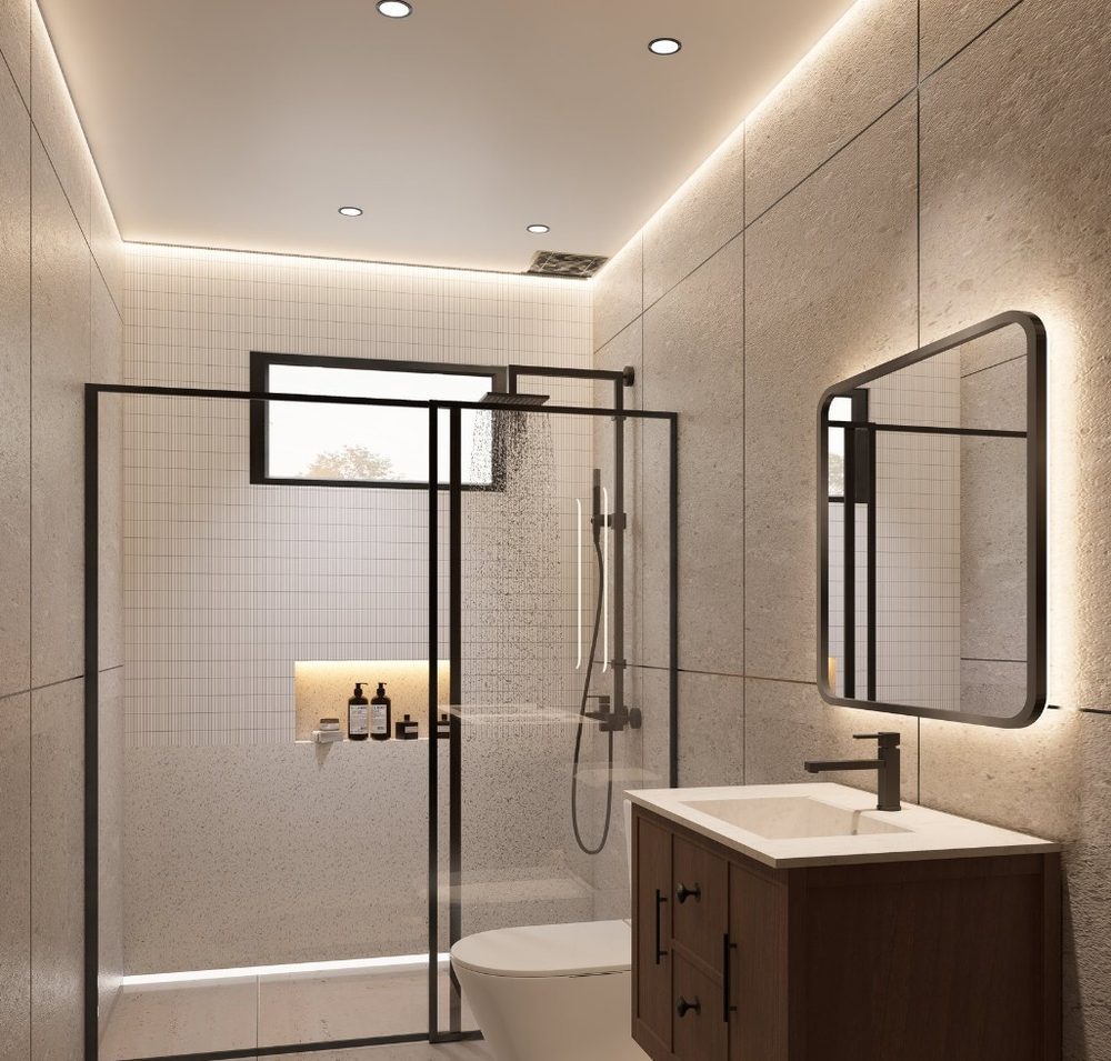 Baño principal con ducha de vidrio, espejo iluminado y mueble de madera oscura
