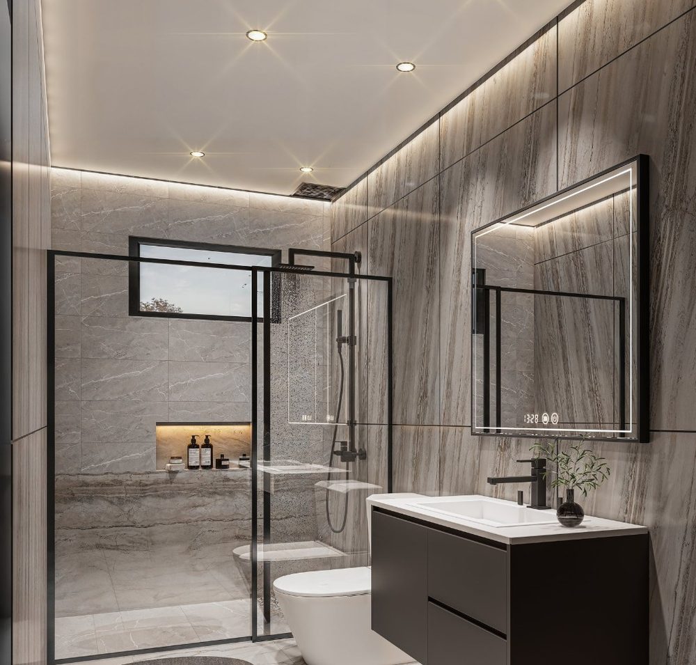 Baño secundario con revestimiento de mármol gris, ducha de vidrio y mueble flotante negro